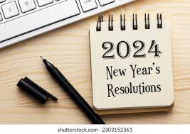 piece of paper and a pen written 2024 new years resolutions