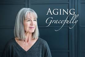 women with gray hair with words aging gracefully written